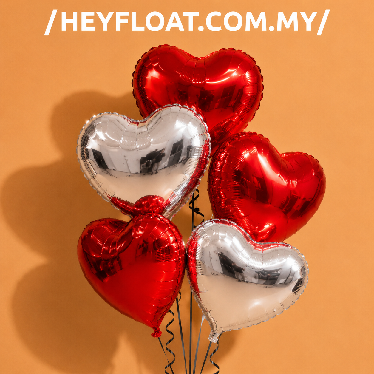 Premium 18 inch heart foil helium balloons in red and silver for birthdays, anniversaries, proposals and romantic celebrations in Malaysia.
